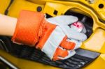 Car Mechanic In His Repair Shop Standing Next To The Car - Close Stock Photo