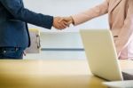 Businessmen Shaking Hands During A Meeting Stock Photo