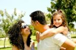 Man Giving Kid A Piggyback Ride Stock Photo