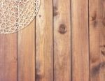 Round Rope Napkin Or Stand On A Wooden Rustic Table. To Create A Stock Photo