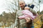 Playful Father And Daughter In Park Stock Photo