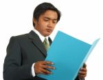 Businessman Reviewing Folder Stock Photo