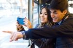 Young Couple Taking Selfies With Smartphone At Bus Stock Photo