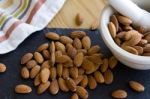 Almonds With A Mortar & Pestle Stock Photo