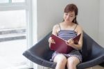 Portrait Of Thai Adult Businesswoman Beautiful Girl Read A Book Stock Photo