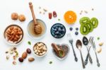 Ingredients For A Healthy Foods Background, Nuts, Honey, Berries Stock Photo