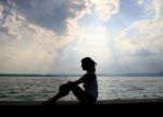 Young Lady Relaxing At Beach Stock Photo