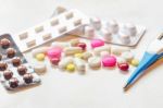 Top View Of The Pills On The White Background, Pack Of Tablet Drug And Capsule Pills On The Floor Stock Photo