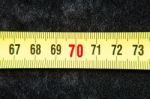 Centimeters Near A Tape Measure On The Number Seventy Stock Photo