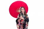 Beautiful Young Asian Woman Wearing Traditional Japanese Kimono With Red Umbrella Isolated On White Background Stock Photo