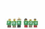 Studio Shot Of Lego Minifigure Holding Word For You On White Background Stock Photo