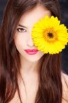 Yellow Daisy Over Woman's Eye Stock Photo