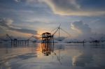 Silhouette Traditional Fishing Method Using A Bamboo Square Dip Stock Photo