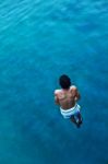 Man Jumping In Water Stock Photo