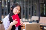 Asia Thai High School Student Uniform Beautiful Girl Read A Book Stock Photo