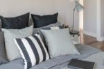 Modern Grey Lamp With Alarm Clock On Side Table In Bedroom Stock Photo