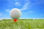 Golf Ball Plastic Tee With Blur Blue Sky Stock Photo