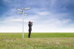 Businessman Using Binoculars Stock Photo