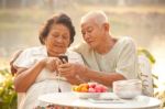 Senior Couple Using The Mobile Phone Stock Photo