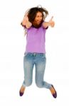 Teenage Girl Jumping With Thumbs Up Stock Photo