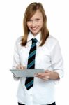 Cheerful Student In School Attire Using Tablet Pc Stock Photo