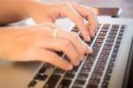 Typing On Keyboard Laptop At Work Table Stock Photo