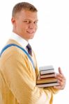 Smiling Male Student Holding Books Stock Photo