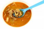 Pork Spicy Curry With Blue Spoon On White Background Stock Photo