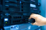 Man Fix Server Network In Data Center Room Stock Photo