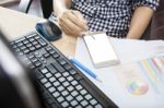 Hand Of Working Woman With Smart Phone Writing Pen On Touching Screen With Copy Space On Office Working Table Stock Photo