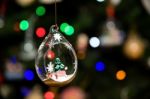 Small Christmas Tree Inside Glass Ornament Hanging On Christmas Tree Stock Photo