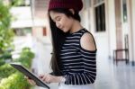 Portrait Of Thai Teen Beautiful Girl Using Her Tablet Stock Photo