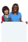 Smiling Friends Holding Blank Board Stock Photo