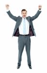 Arms Raised Businessman Standing Stock Photo