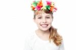 Little Girl In Wreath Of Flowers Stock Photo