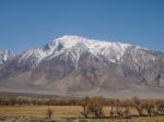 Snow Capped Mountains, Blue Sky, Desert Landscape Stock Photo