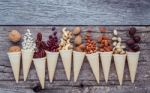 Concept For Homemade Various Nuts Ice Cream. Mixed Nuts In Waffl Stock Photo