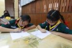 Activity Of Teaching Elementary Students. Elementary Students Are Test Lesson. The Students Intend Exam Stock Photo