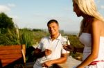 Couple Enjoying Champagne On Holiday Stock Photo