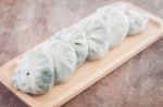 Chinese Leek Steamed Dessert On Wooden Table Stock Photo