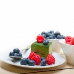 Green Tea Matcha Mousse Cake With Berries Stock Photo