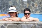 Two Sexy Women In The Pool. Focus In The Right Lady Stock Photo