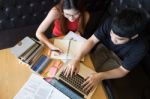 Young Student Preparing To Exams And Smiling. Woman Tutor Standi Stock Photo