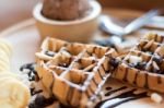 Belgian Waffles With Strawberry, Cherry, Blueberry, And Chocolat Stock Photo