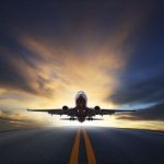 Passenger Plane Take Off From Runways Against Beautiful Dusky Sk Stock Photo