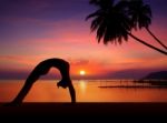 Silhouette Girl Doing Yoga Stock Photo