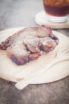 Pork Steak On Wooden Plate Stock Photo