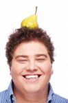 Chubby Boy And Pear Stock Photo