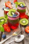 Red And Green Jelly Served With Fruit Stock Photo