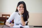 Portrait Of Thai Teen Beautiful Girl Writing Book Stock Photo